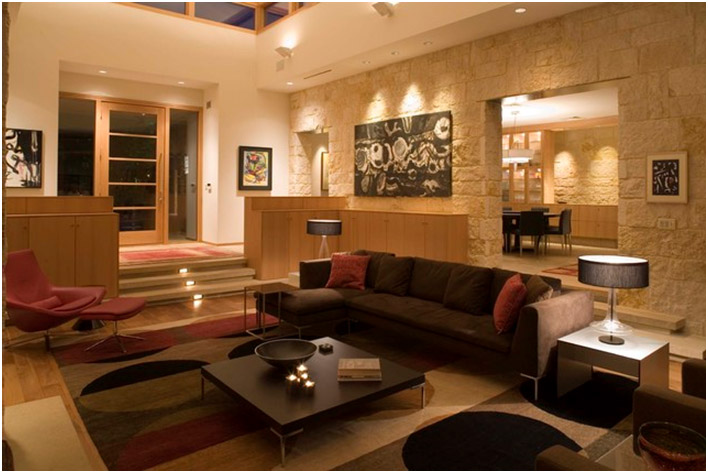 FabModula interior designer products aesthetically lighted living hall with paintings and sofa set, coffee table and lamps